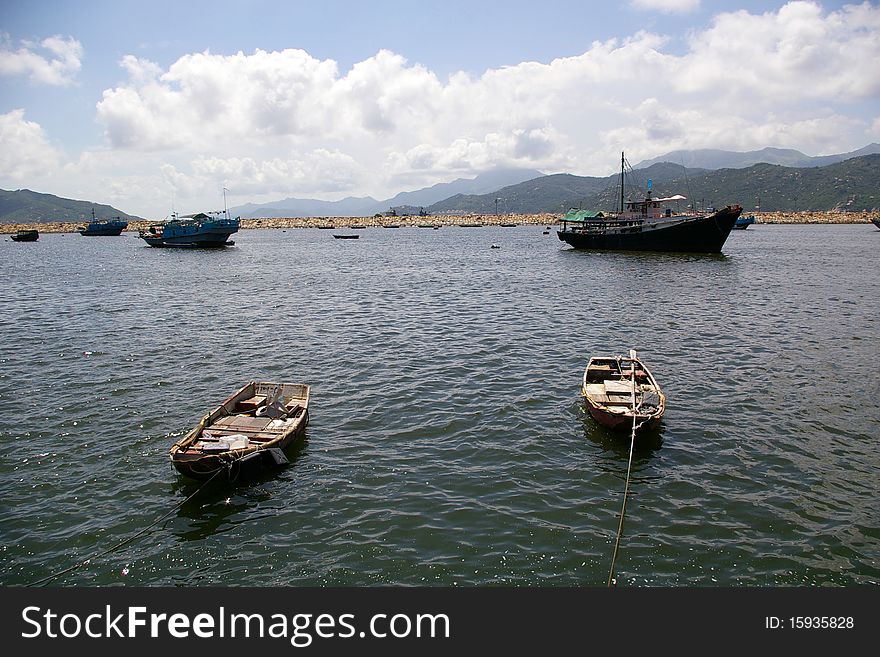 There are some boats along the coast with blue sky, in Cheung Chau, Hong Kong. There are some boats along the coast with blue sky, in Cheung Chau, Hong Kong.