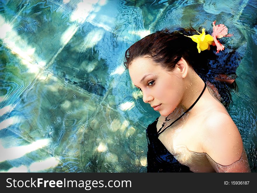 Beautiful young woman on the water surface. Beautiful young woman on the water surface