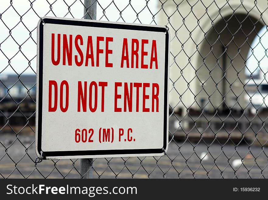 A red on white sign warning of an unsafe area. A red on white sign warning of an unsafe area