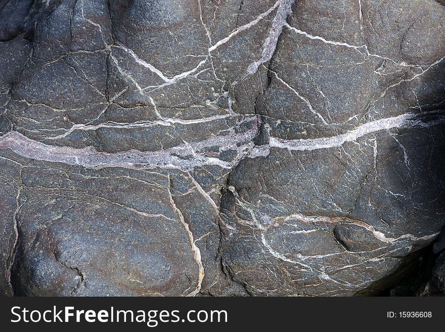 Structure of the stone laying on coast of the river. Russia. Kamchatka. Structure of the stone laying on coast of the river. Russia. Kamchatka.