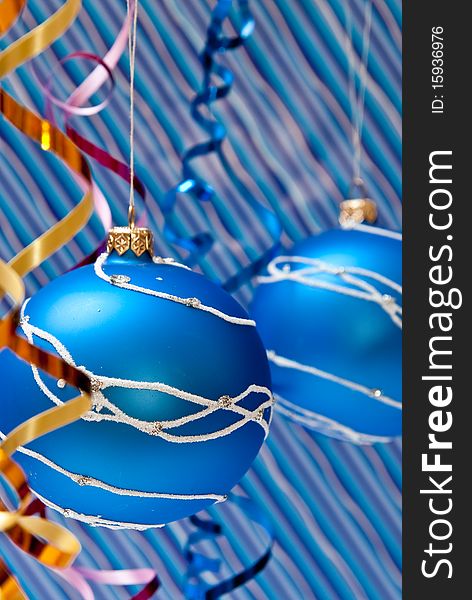 Christmas decoration from two blue balls on blue background