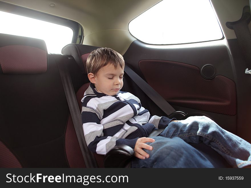 Child sleeping in a car. Child sleeping in a car