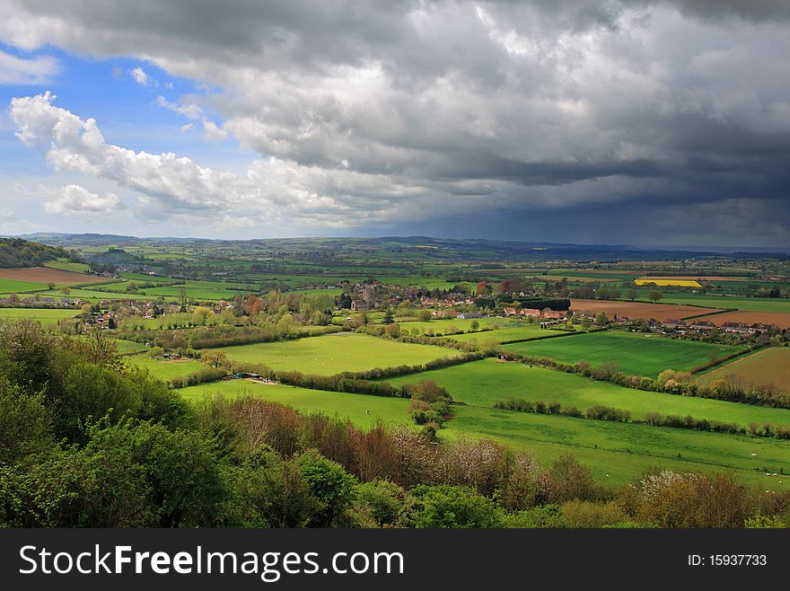 A Landscape in Rural Somerset with ominous Cumulonimbus storm clouds. A Landscape in Rural Somerset with ominous Cumulonimbus storm clouds