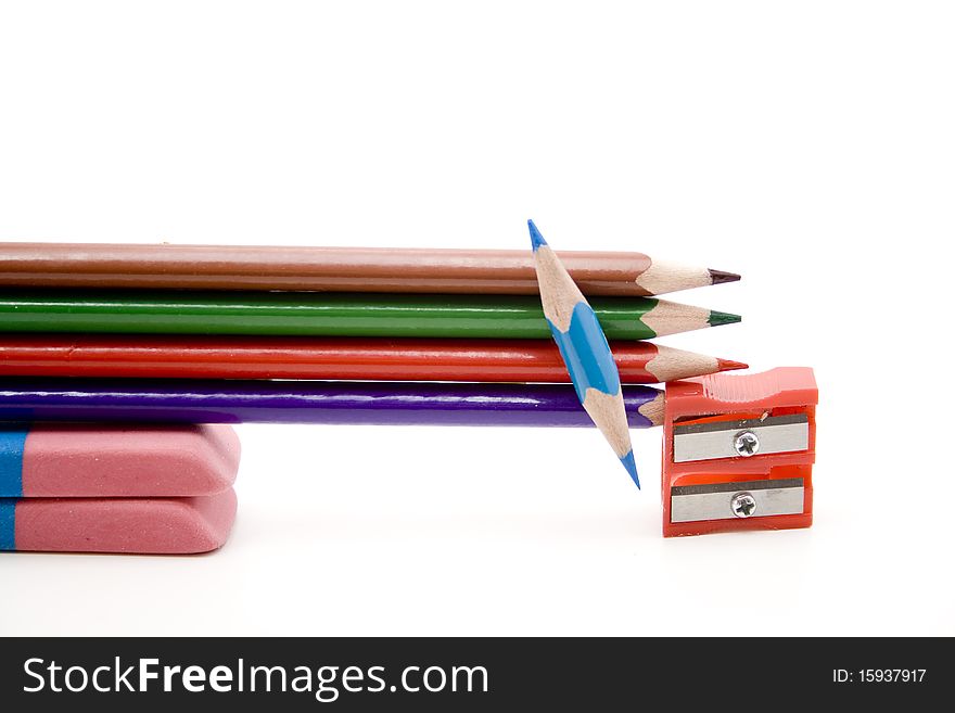 Colored pencils with plastic sharpeners and erasers. Colored pencils with plastic sharpeners and erasers