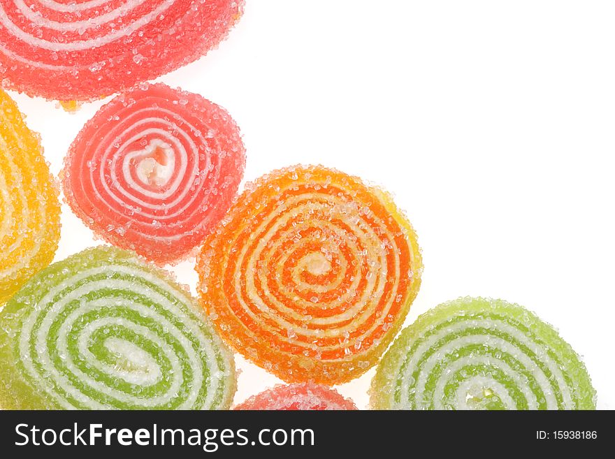 Coloured fruit candies on a white background.