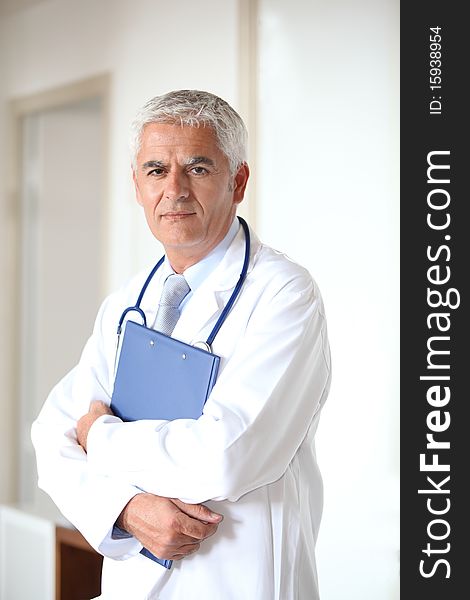 Portrait of doctor standing in hall. Portrait of doctor standing in hall