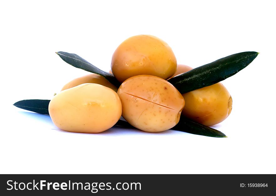 Green olives with leaves isolated on white background