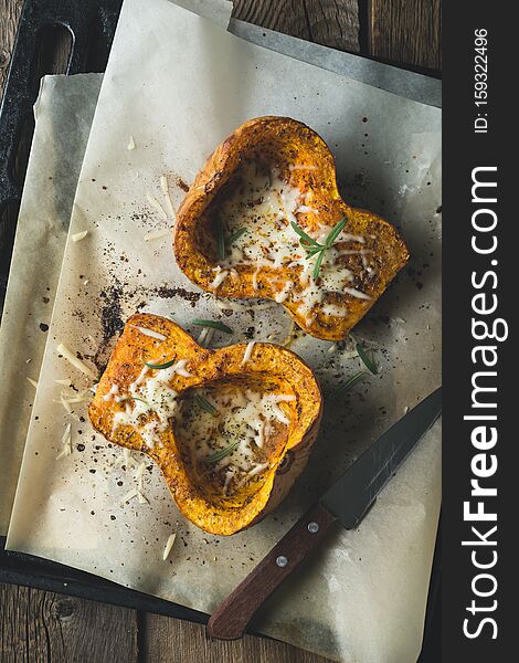 Baked pumpkin with spices and grated chees