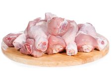 Raw Chicken Legs On Chopping Board Stock Image