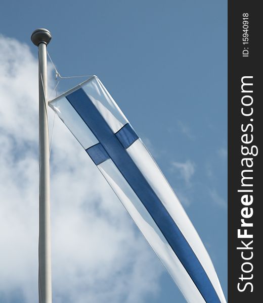 Finnish pennant flag on a flagpole. Finnish pennant flag on a flagpole