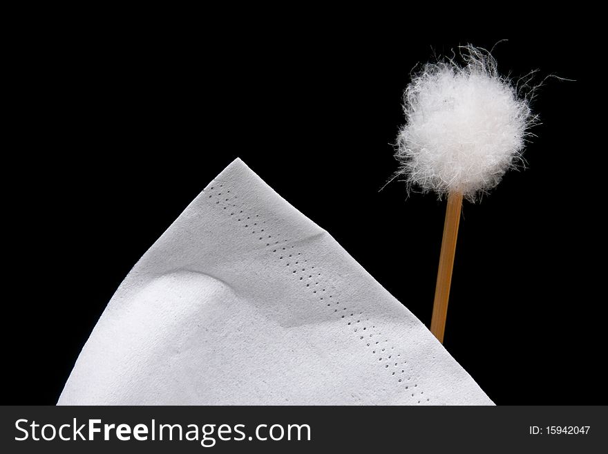 White Tissue And Cotton Ball On Black Background