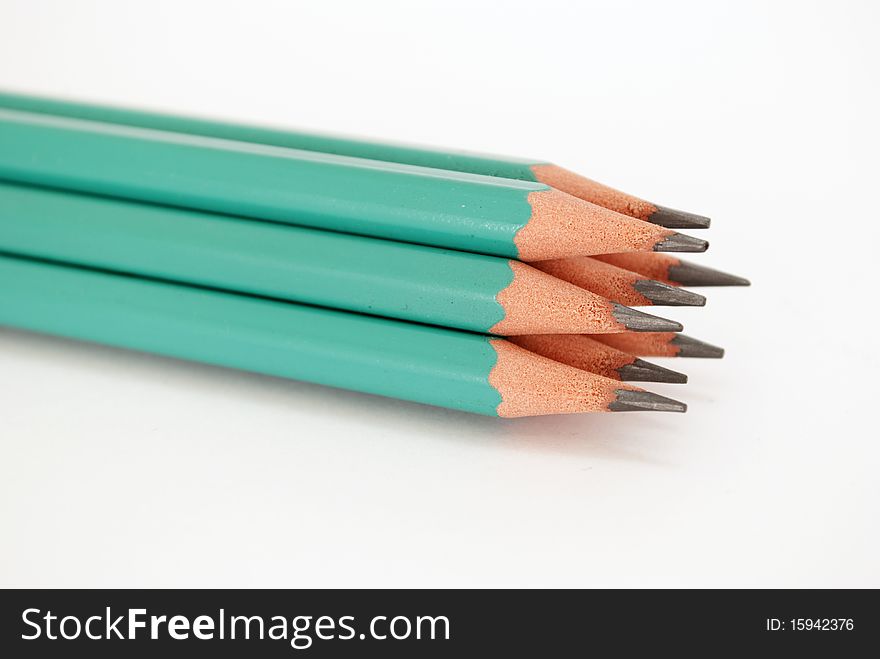 Green pencils tipped with white background isolated