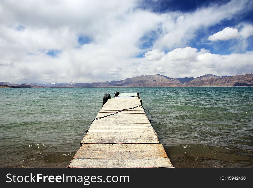 Wooden bridge into the sea