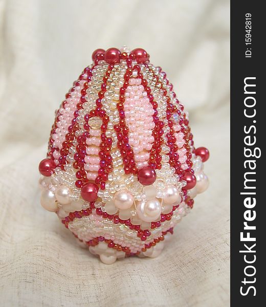 Hand-made colorful Easter egg, decorated with different sorts of beads and natural fresh-water pearls. Hand-made colorful Easter egg, decorated with different sorts of beads and natural fresh-water pearls.