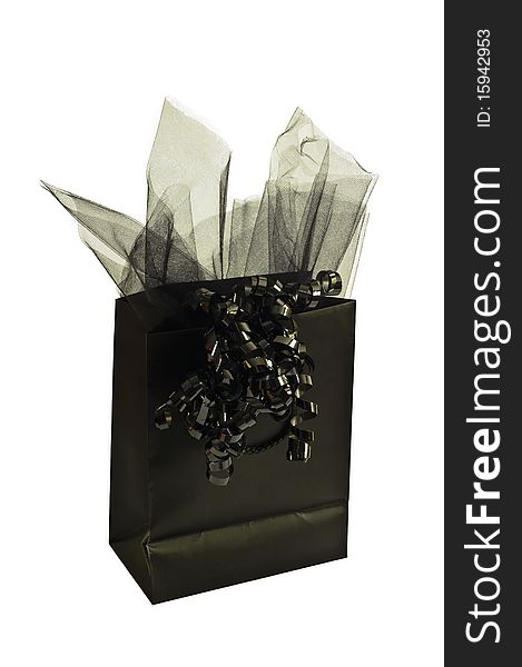 A Black gift bag with black netting and ribbon isolated on a white background can be used for Halloween.