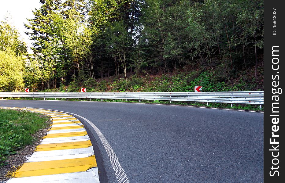 Curved road in the mountain forest