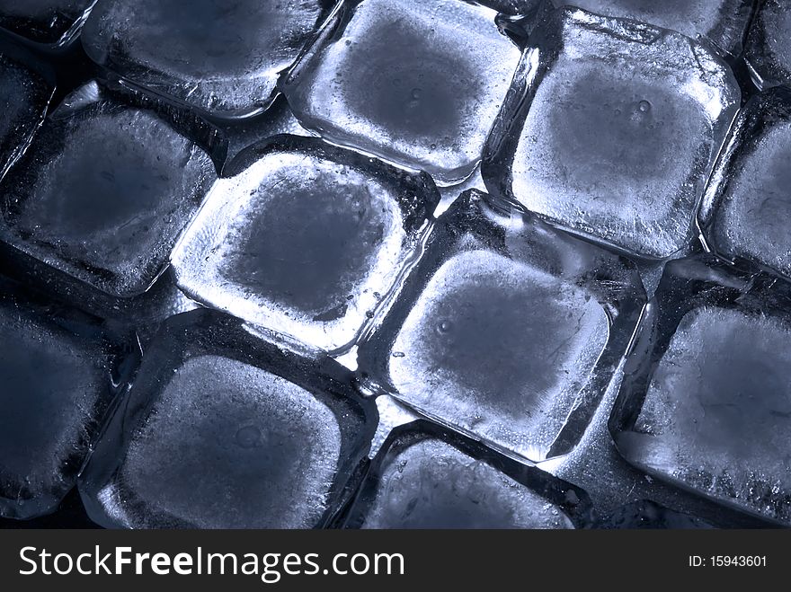 Ice cubes, ordered in rows, in back-light