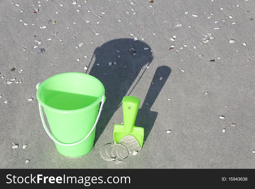 Green Bucket On A Beach