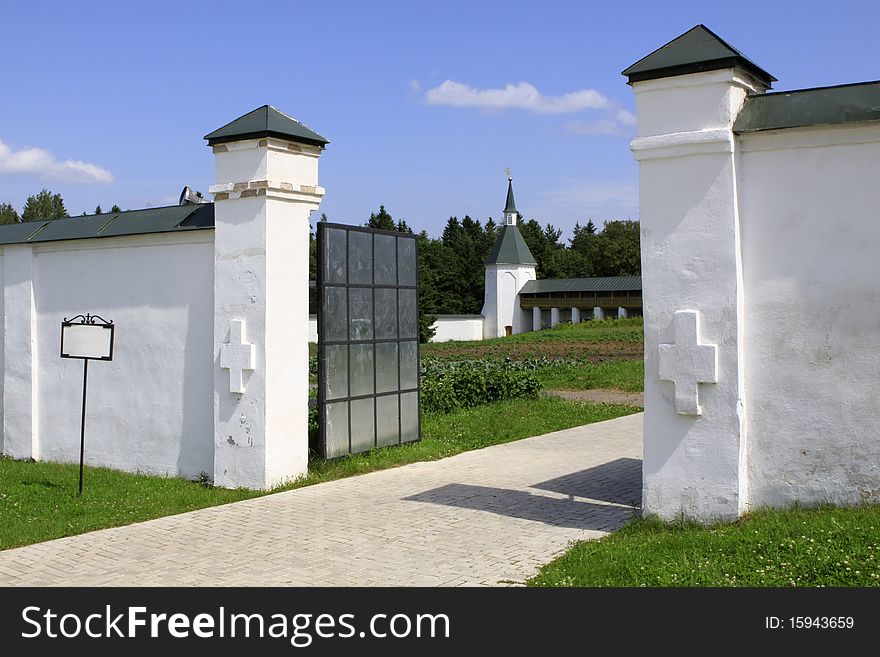 View on the Monastic kitchen garden through the gate of Valdaisky Iversky Svyatoozersky Bogoroditsky Monastery.