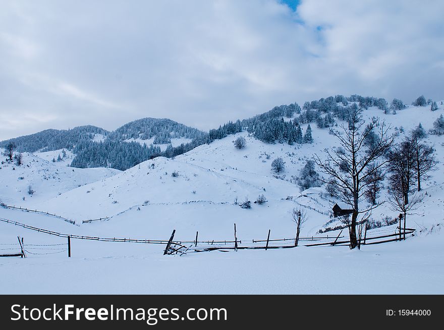 Isolated House in Mountains in Winter Landscape