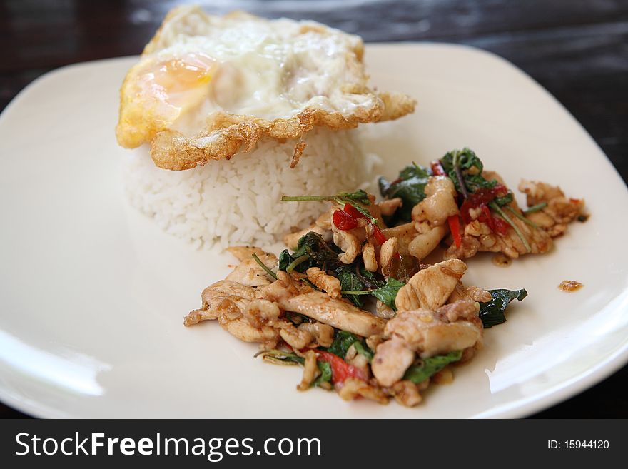 Rice With Basil Pork Chicken And Fired Egg On Top