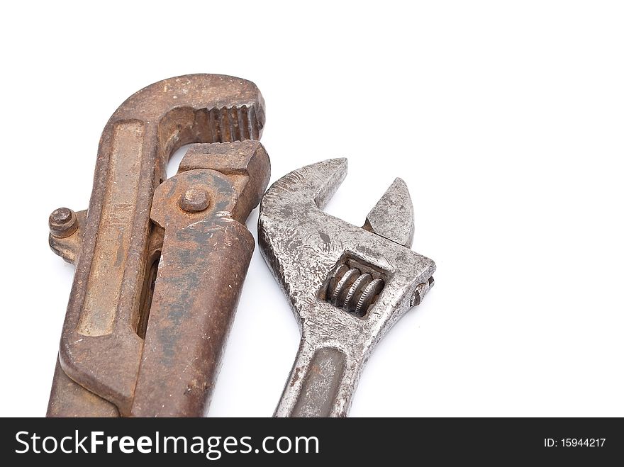 Rusty metal screw-wrenches on white