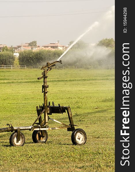 High range sprinkler in a field. High range sprinkler in a field