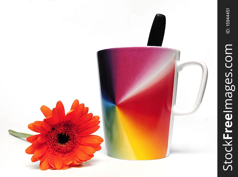 Cup of coffee and red flower on white background. Cup of coffee and red flower on white background