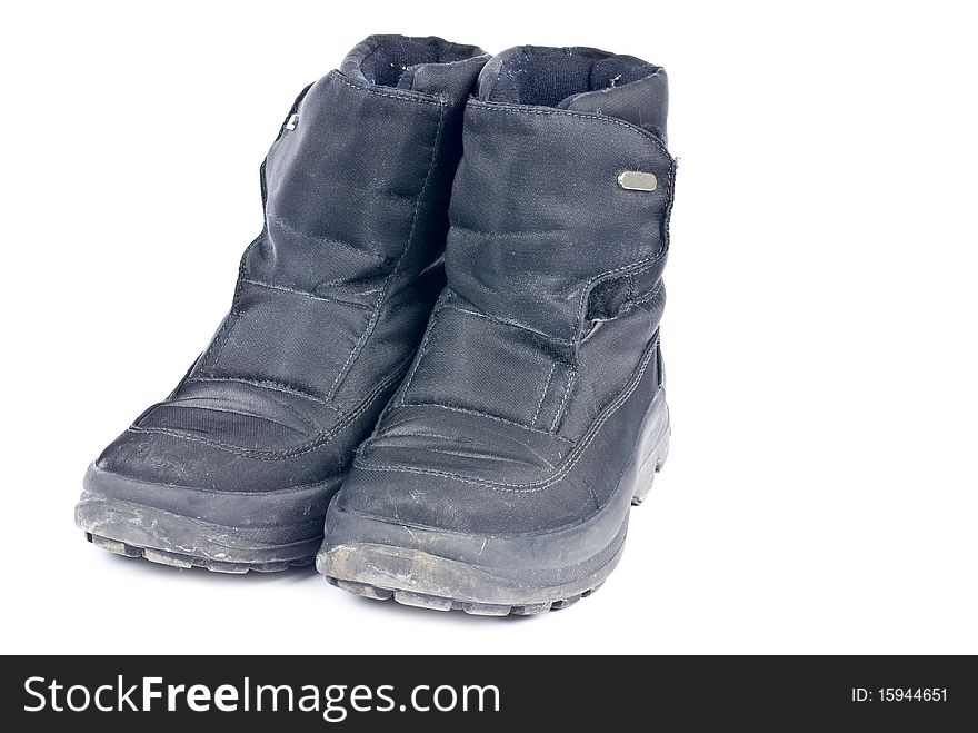 A pair of woman's black nylon winter boots isolated on white.