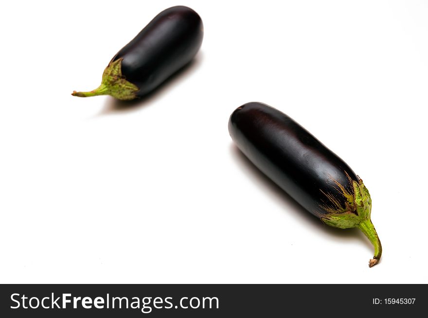 Two eggplants are isolated on a white background