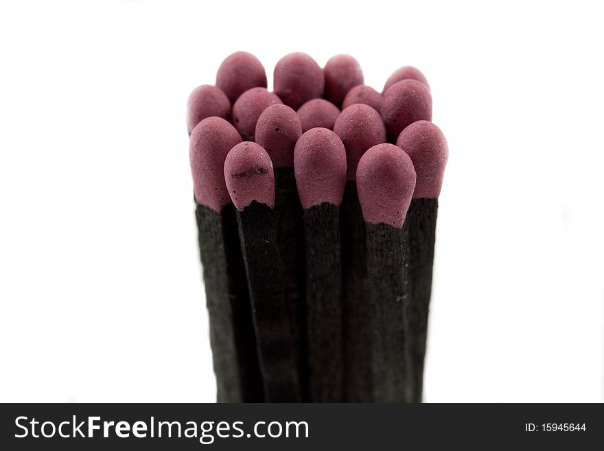 Macro image of a bunch of matchsticks isolated on white background. Macro image of a bunch of matchsticks isolated on white background