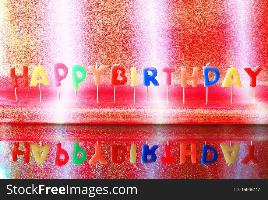 Birthday candles on colorful background