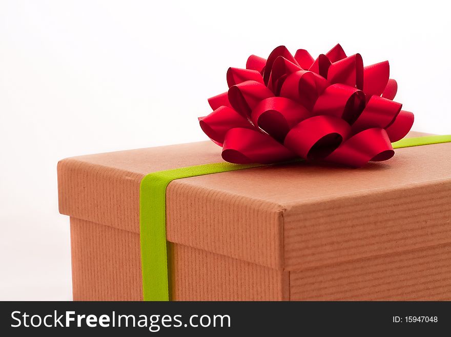 Red Bow On Present Box With Green Ribbon