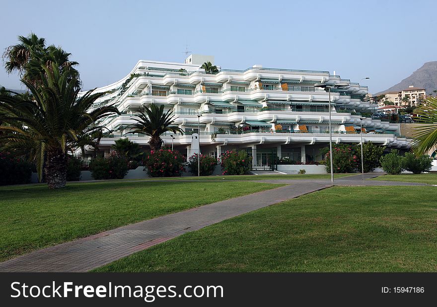 Big hotel with palms and stones around on Costa Adeje, Tenerife. Big hotel with palms and stones around on Costa Adeje, Tenerife