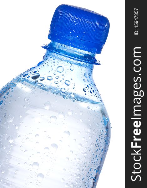 Plastic bottle with water drops on white background