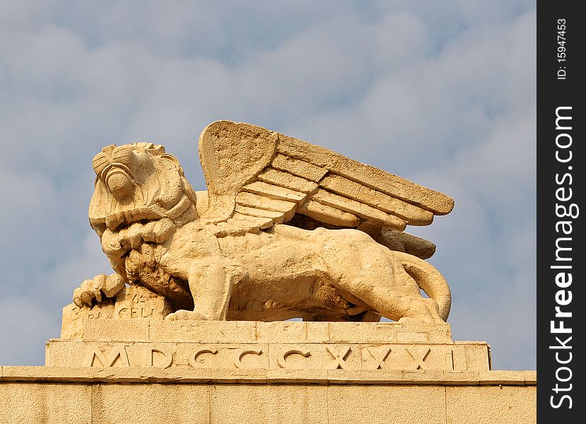 A winged lion statue carved in rock. A winged lion statue carved in rock