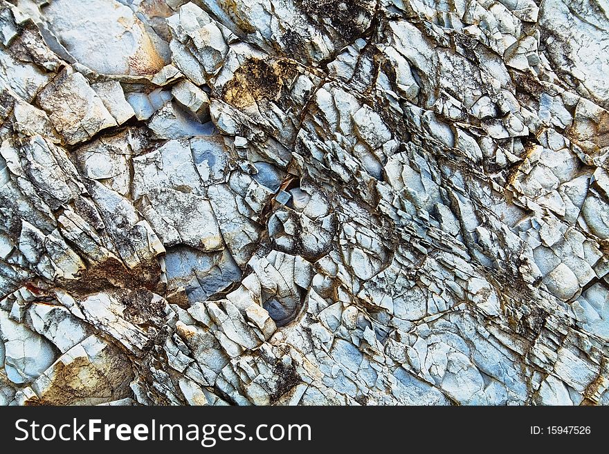 A sample of natural mountain rock texture. A sample of natural mountain rock texture