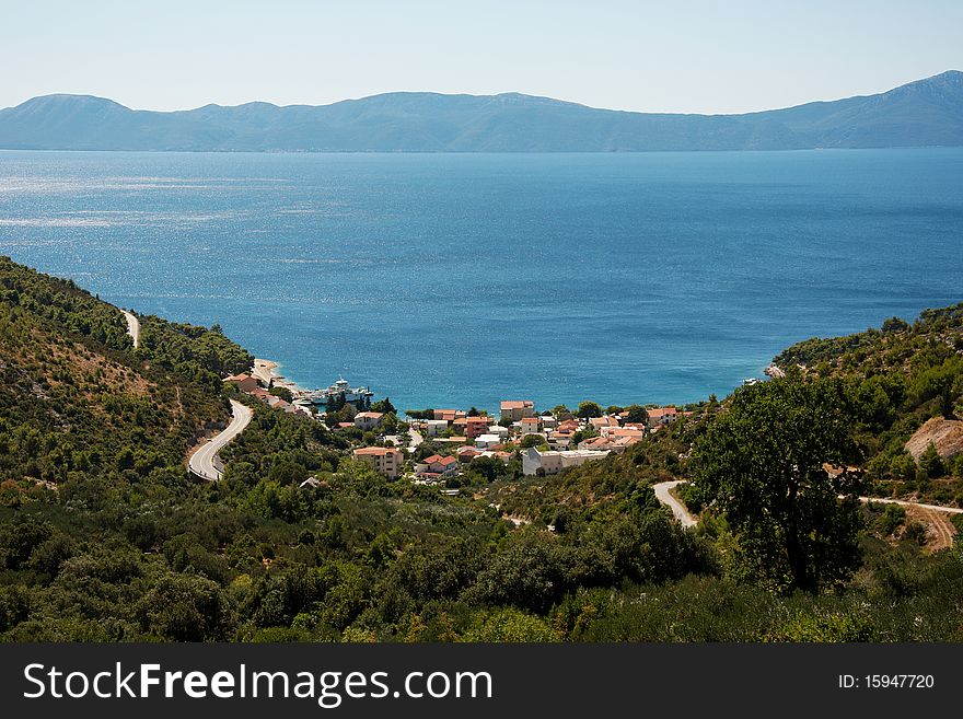 A view of the village of Drvenik, Croatia in the middle of green nature and the sea