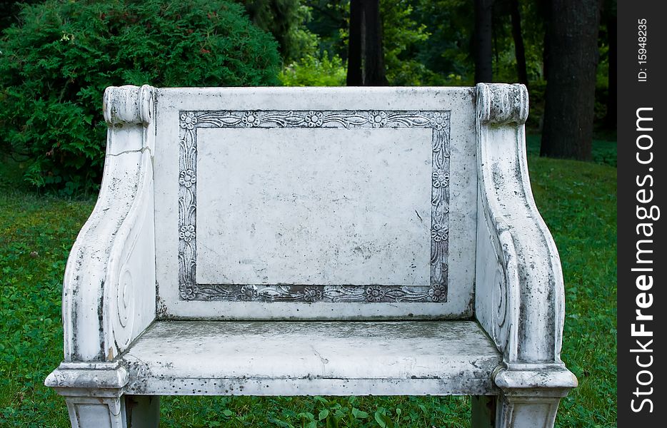 Gray and dirty stone chair on the nature backgorund