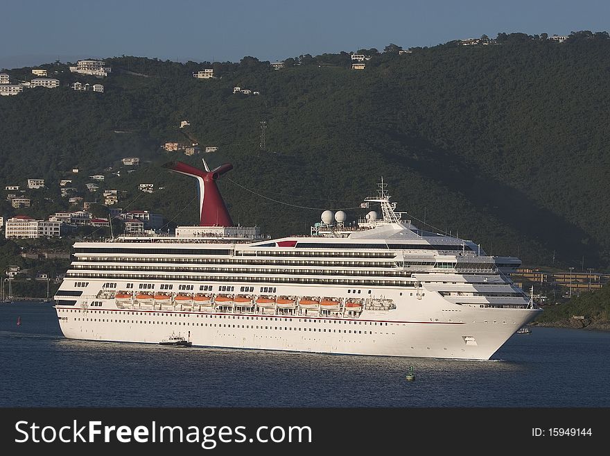 A Cruise Ship leaves port in the Caribbean island of St Thomas. A Cruise Ship leaves port in the Caribbean island of St Thomas