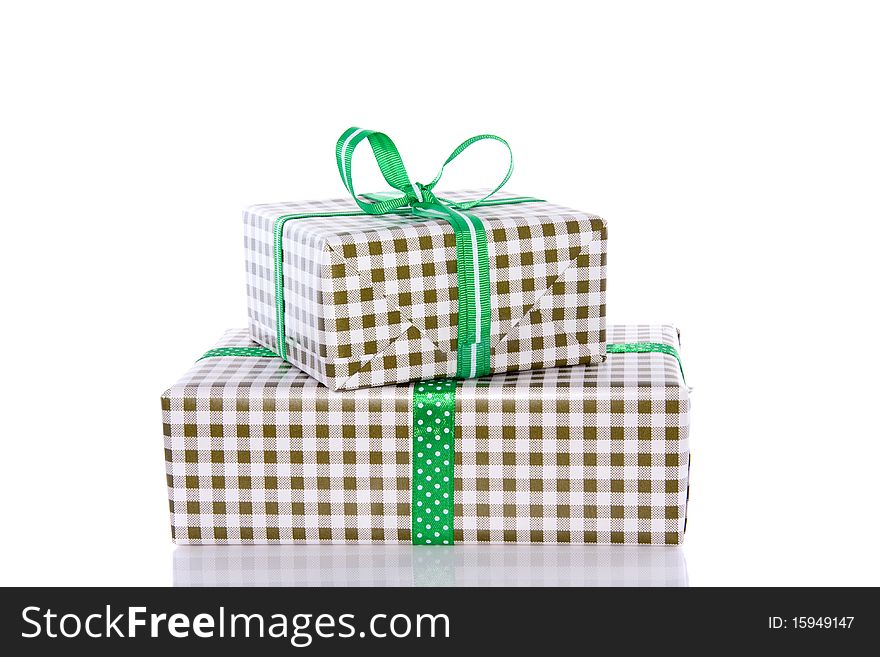 Two green white checkered stacked presents isolated over white. Two green white checkered stacked presents isolated over white