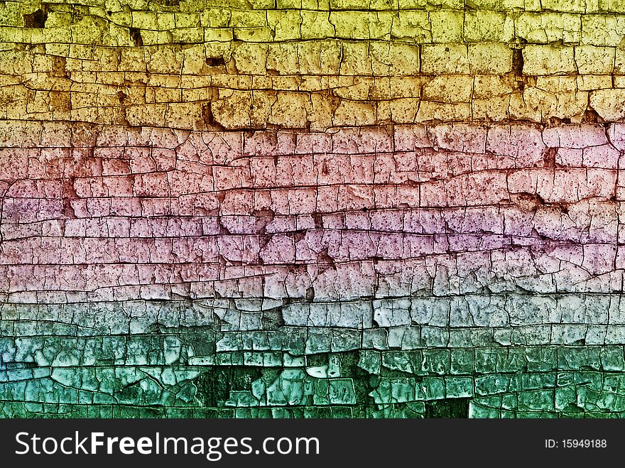The old multi-colored cracked wall. The old multi-colored cracked wall