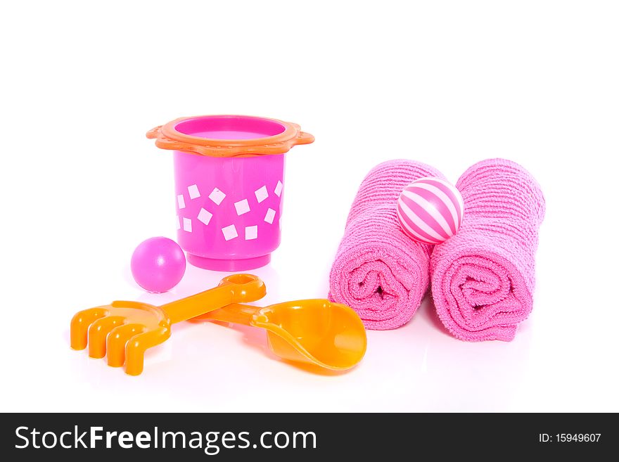 Summer beach toys en towels isolated over a white background