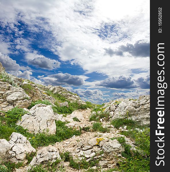 Blue sky with clouds above mountain