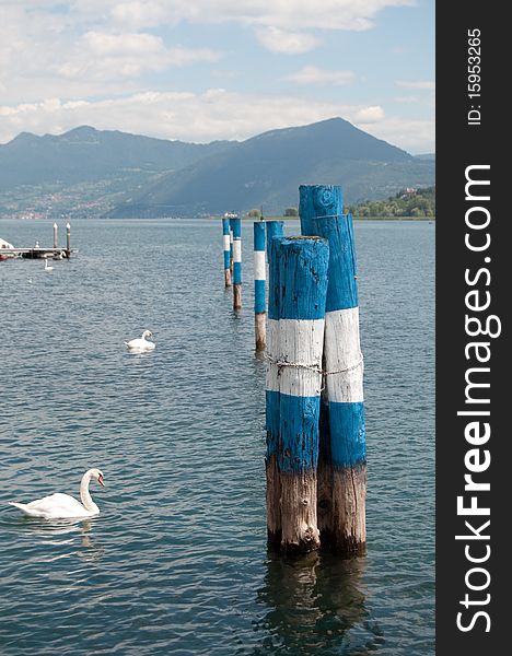 Landscape of Lake Iseo with wooden posts