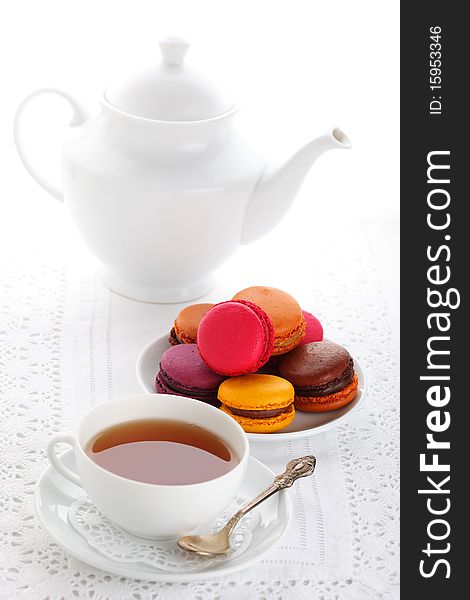 Tea with macaroons on white isolated background. Tea with macaroons on white isolated background
