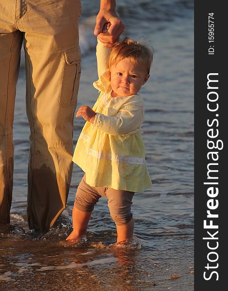 Child walks by the sea