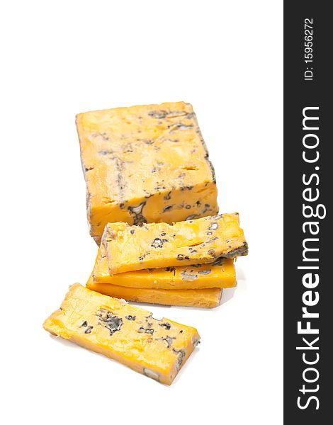 Golden roquefort cheese isolated on white background