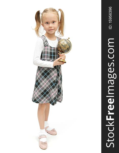 Cute little schoolgirl holding a globe studio shot on white background. Cute little schoolgirl holding a globe studio shot on white background