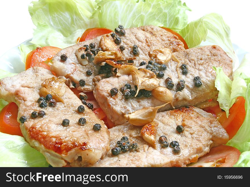 Pork chop Steak with Black Pepper on green salad